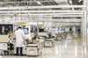 Employees work on the assembly line of a Huawei Technologies Co. mobile phone plant in Dongguan, China, on Tuesday, January 15, 2019.
