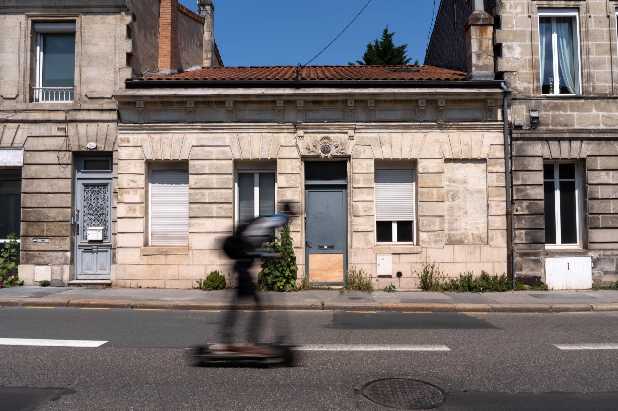 Why do the entry doors to most homes open inward, while in most public  buildings, the entry doors open outward?