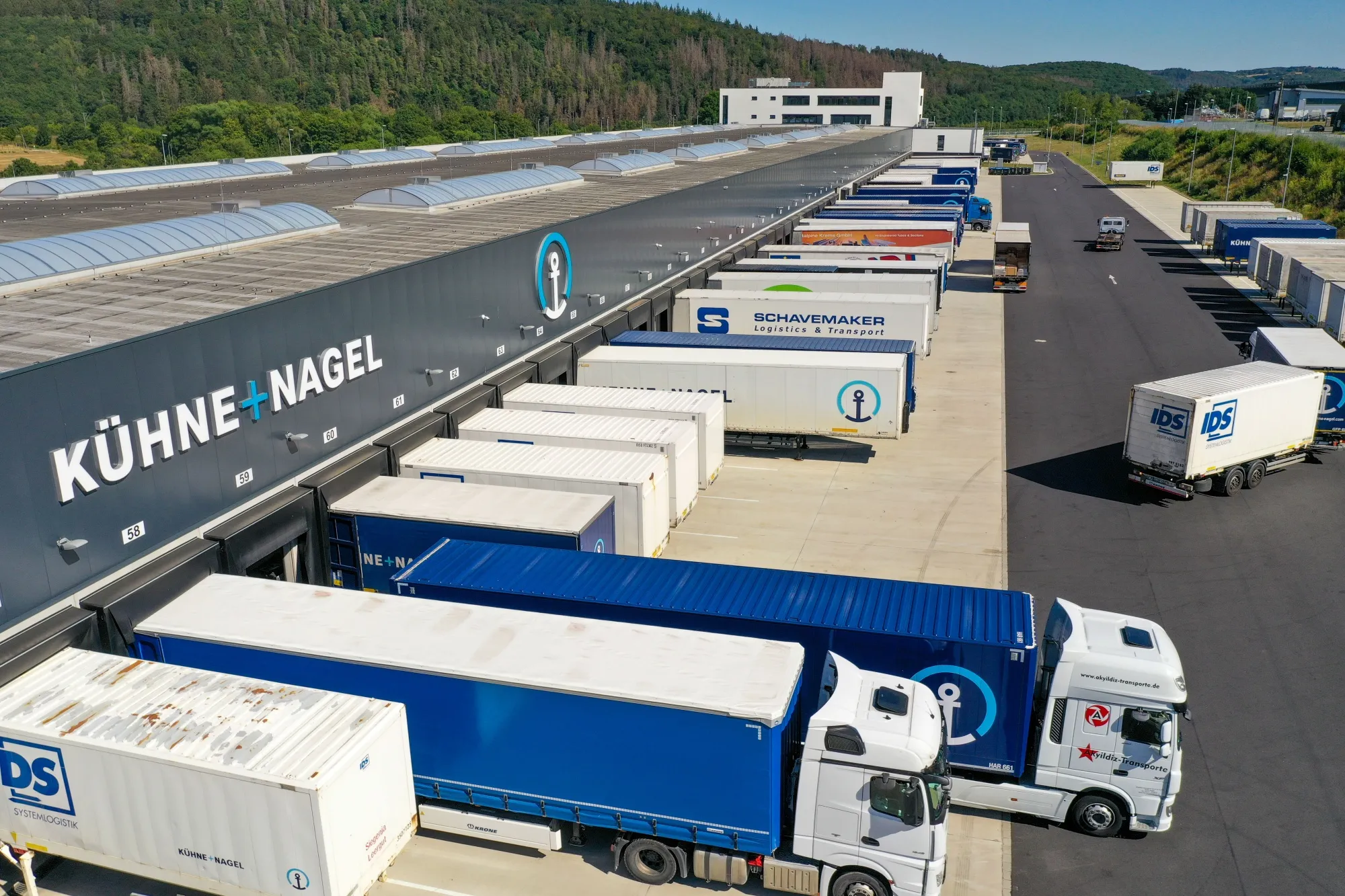 Trailers at loading bays at the Kuehne + Nagel International AG logistics center in Haiger, Germany.