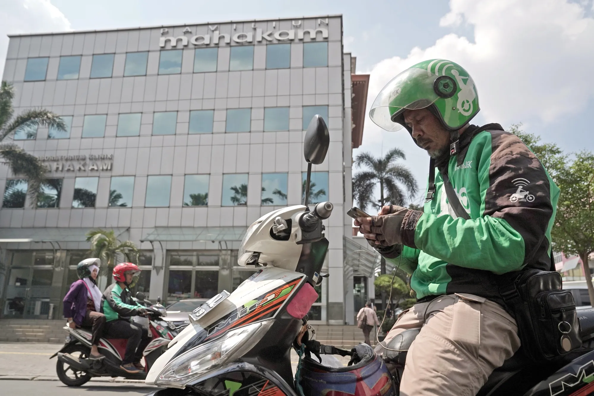 A Gojek motorcycle driver in Jakarta is an emblem of Indonesia’s private-sector innovation culture.