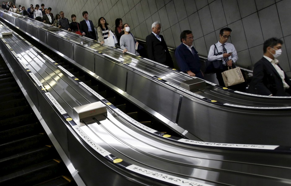 In Tokyo, one side of the escalator is usually reserved for walkers. A new campaign ask that they now stand on both sides.