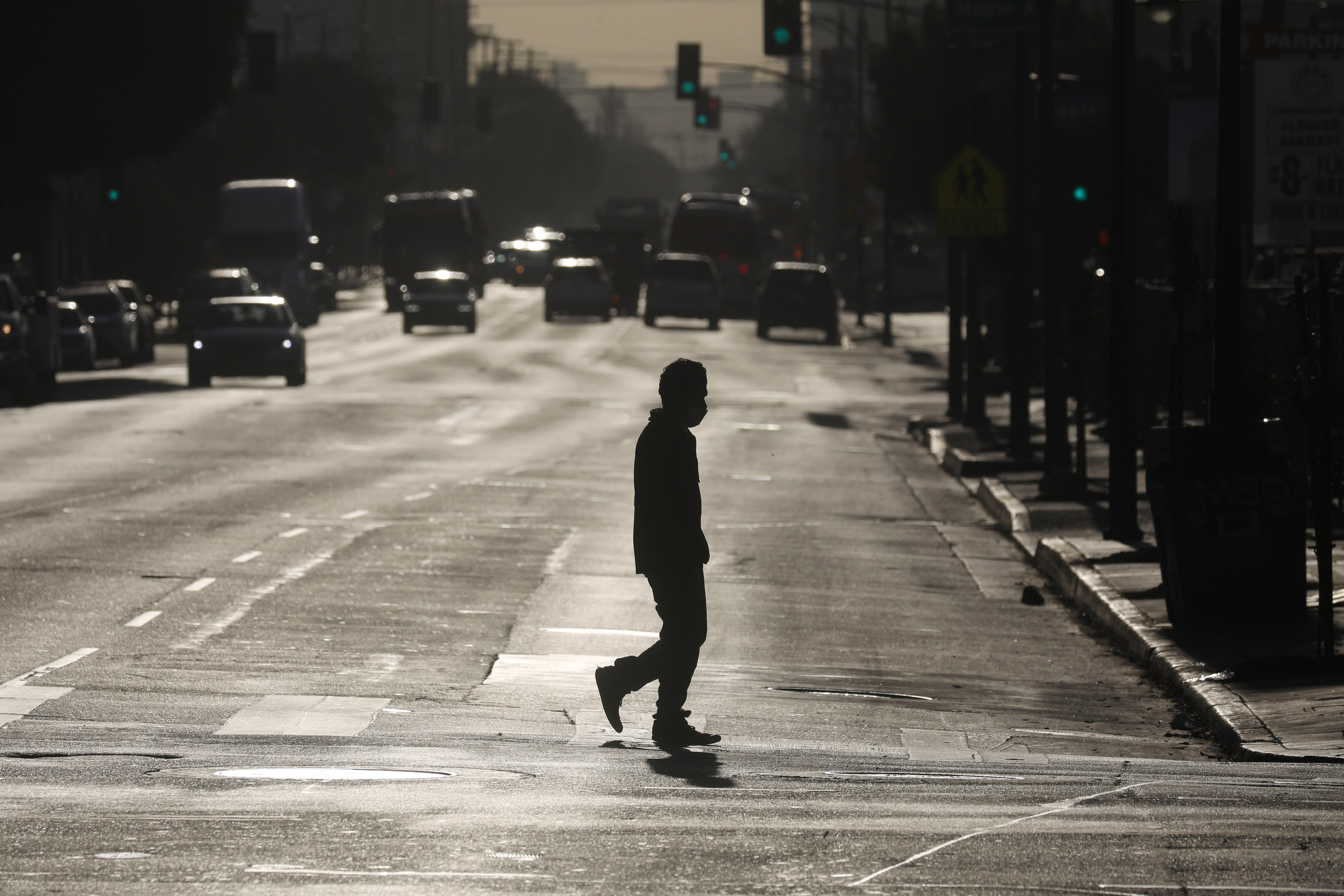 A pedestrian crosses a street in downtown Los Angeles&nbsp;on&nbsp;Dec. 3.&nbsp;
