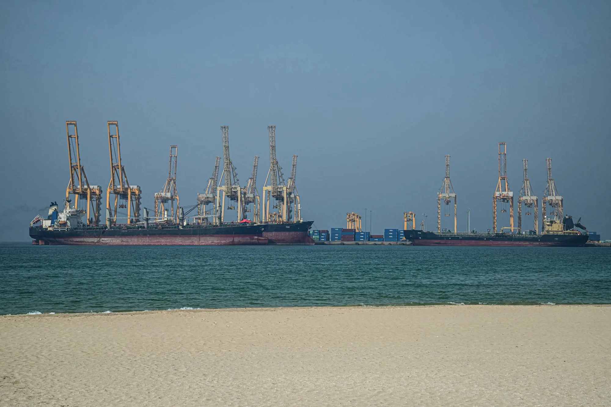Ships at the Khor Fakkan Container Terminal in the Sharjah Emirate along the Strait of Hormuz.