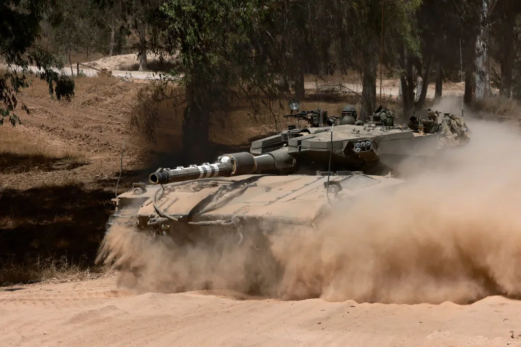 An Israeli tank takes position on&nbsp;the southern border with the Gaza Strip, on June 2.