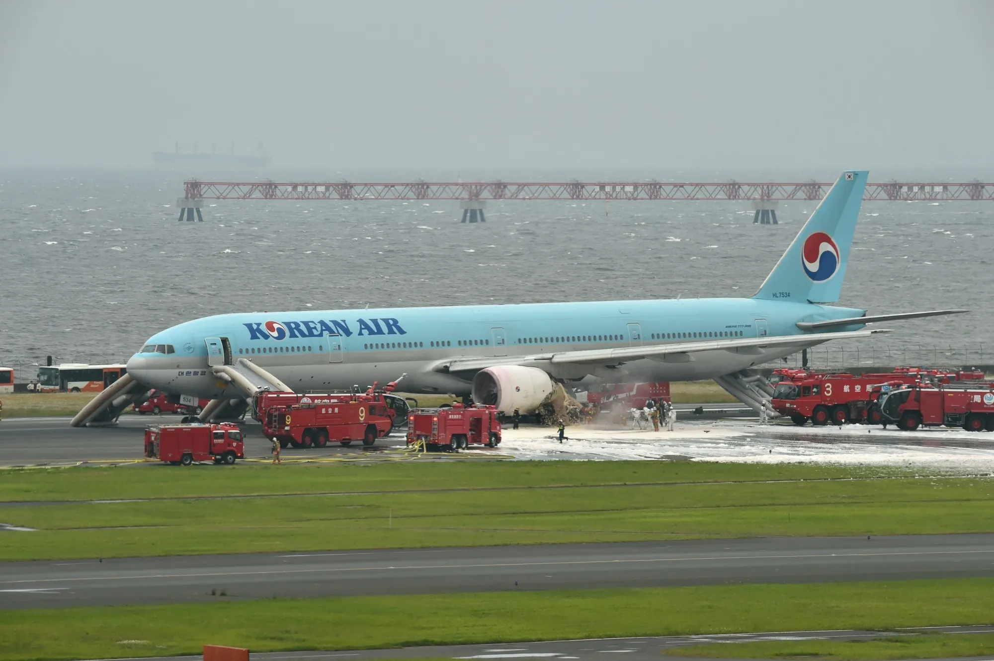 Ground crew put out a fire on a Korean Air plane in Tokyo's Haneda Airport.
