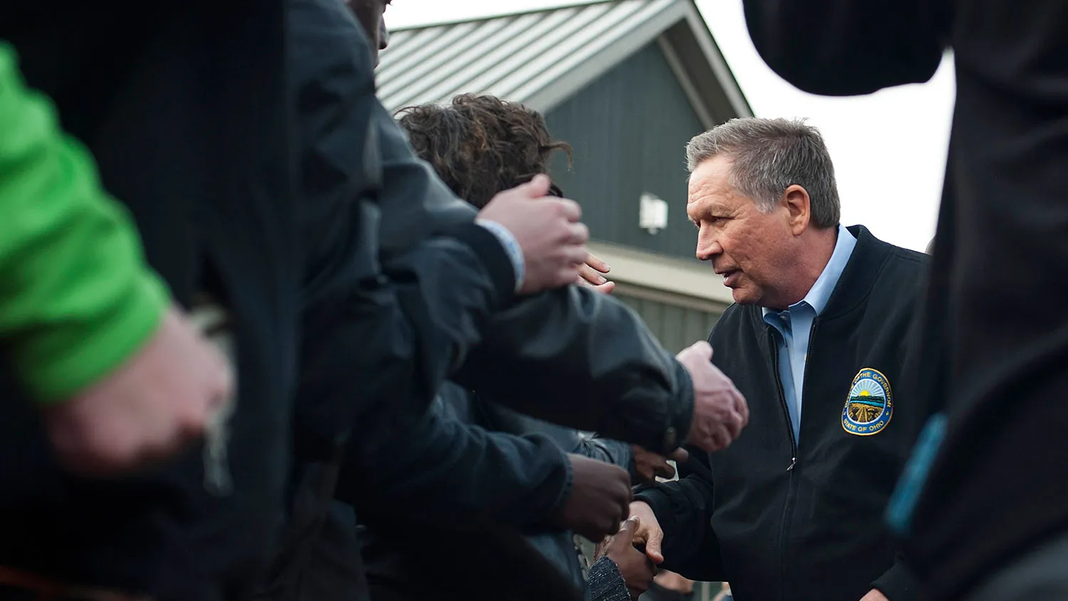 Ohio Governor John Kasich shakes hands with attendants in the crowd after speaking at a campaign rally on March 6, 2016, in Columbus, Ohio.
