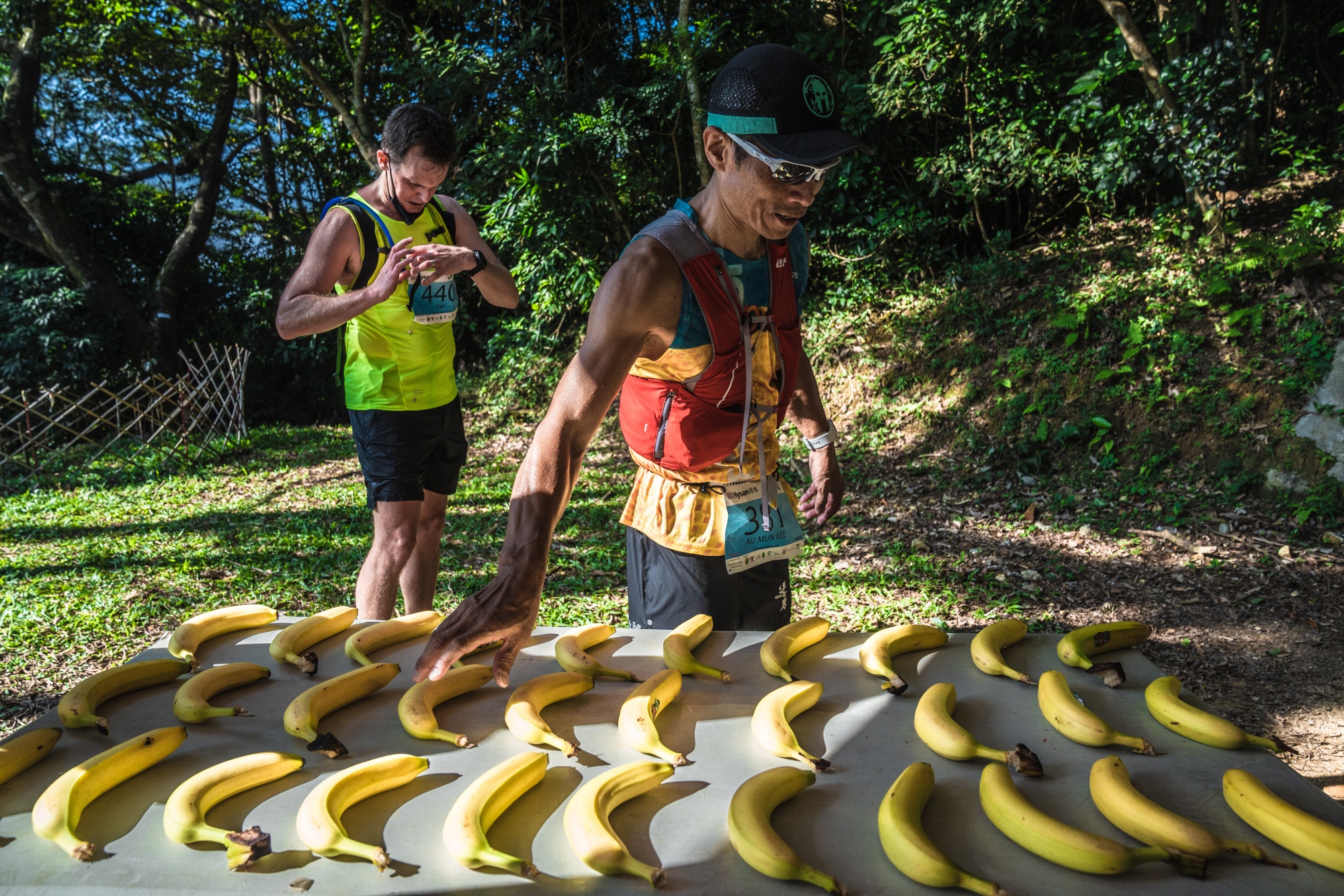 A runner takes a banana at a support station during the Island Hike & Run organized by Action Asia, in Hong Kong, on Nov. 13.
