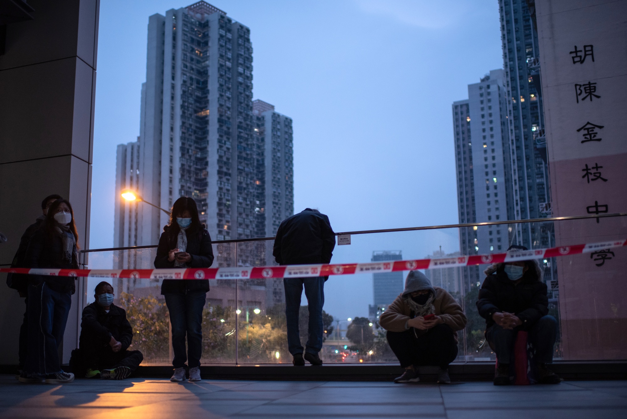 People wait outside a&nbsp;community testing center in Hong Kong, China.