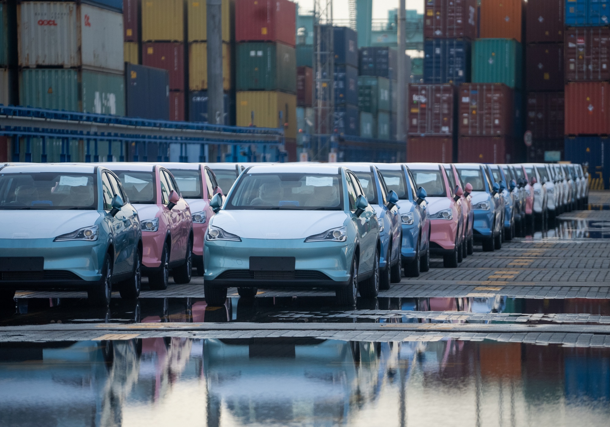 NETA V electric cars at a Chinese port ready for export to Thailand.