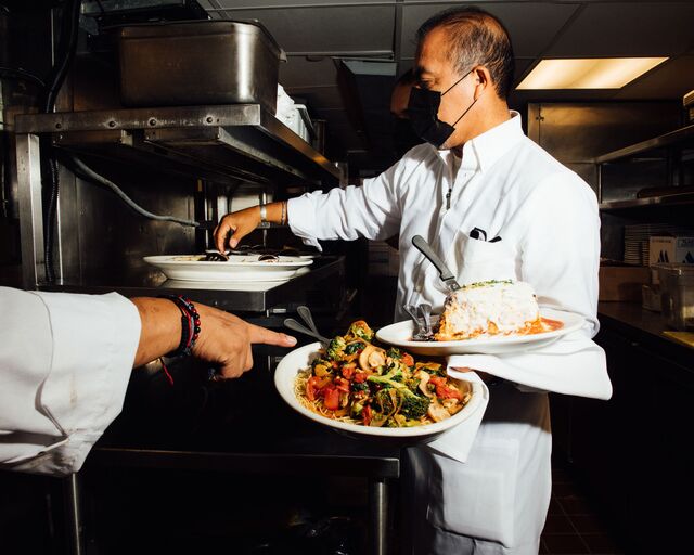 A server at the food runner station during the mock service at Carmine's Italian Restaurant - Times Square location