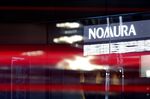 Signage outside a branch of Nomura Securities Co. Japan, April 22, 2025.