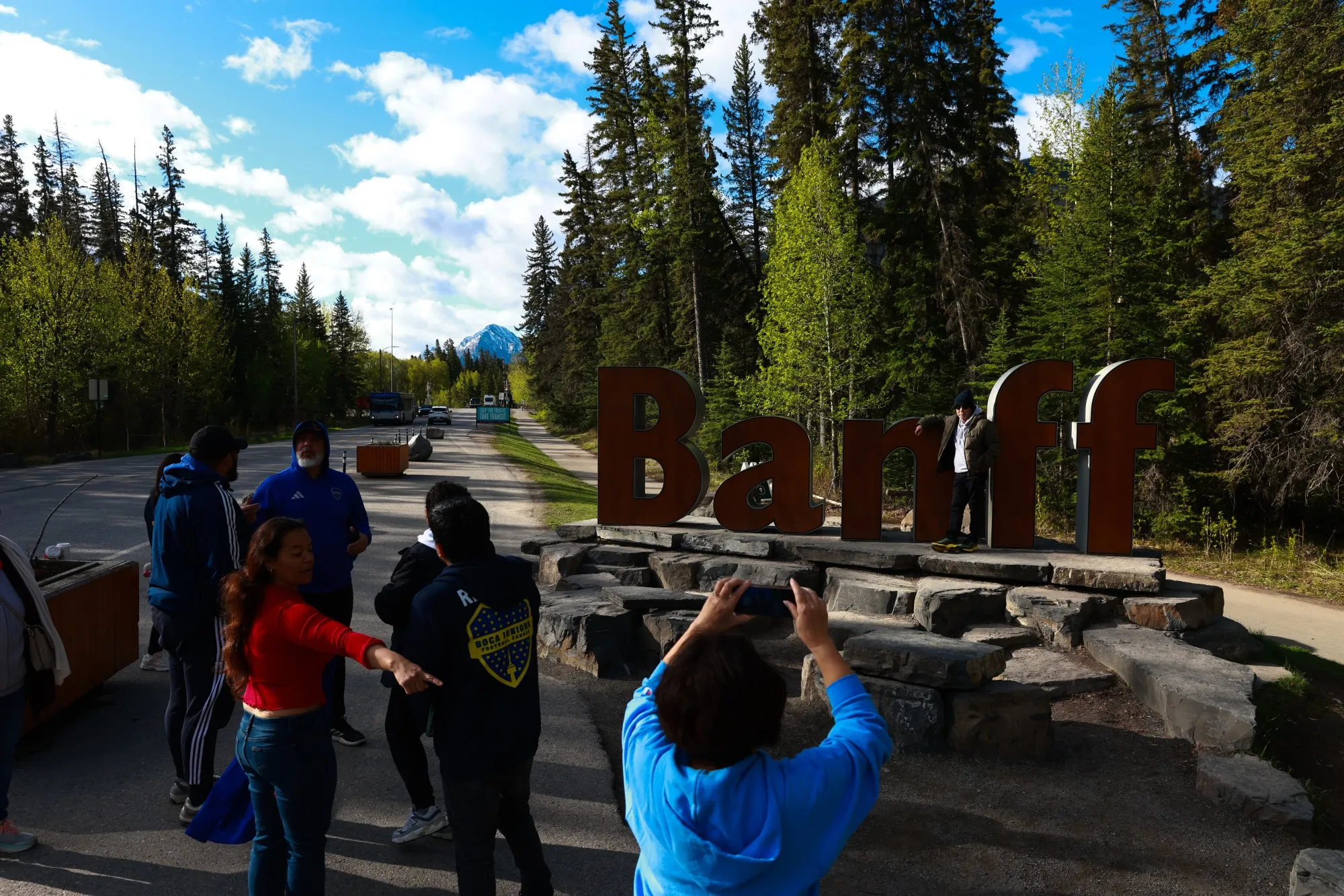 Visitors take photos with the Banff town sign ahead of the G7 Finance Ministers and Central Bank Governors' Meeting in Banff, Alberta, Canada on May 20.