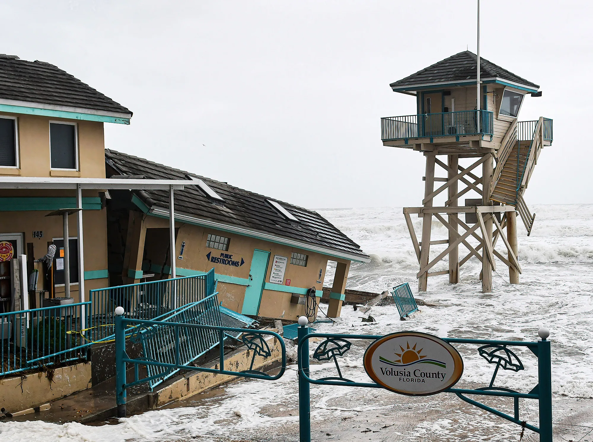 Waves crash near a damaged building and a lifeguard tower in Daytona Beach Shores,&nbsp;Florida, on Nov. 9.