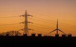 An electricity transmission pylon and wind turbine&nbsp;in Bradwell-on-Sea, U.K.