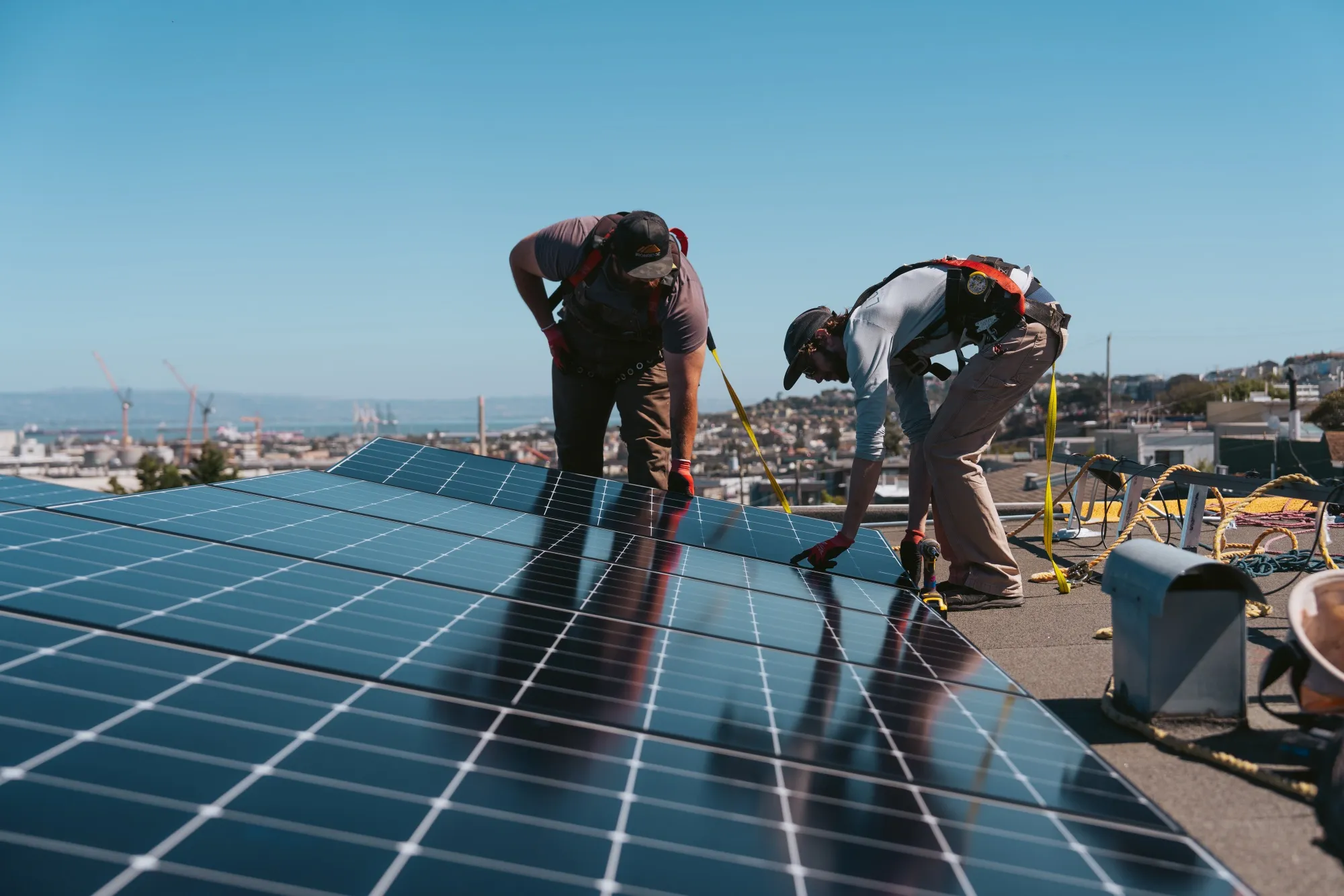 Workers install solar panels&nbsp;at a home in San Francisco.