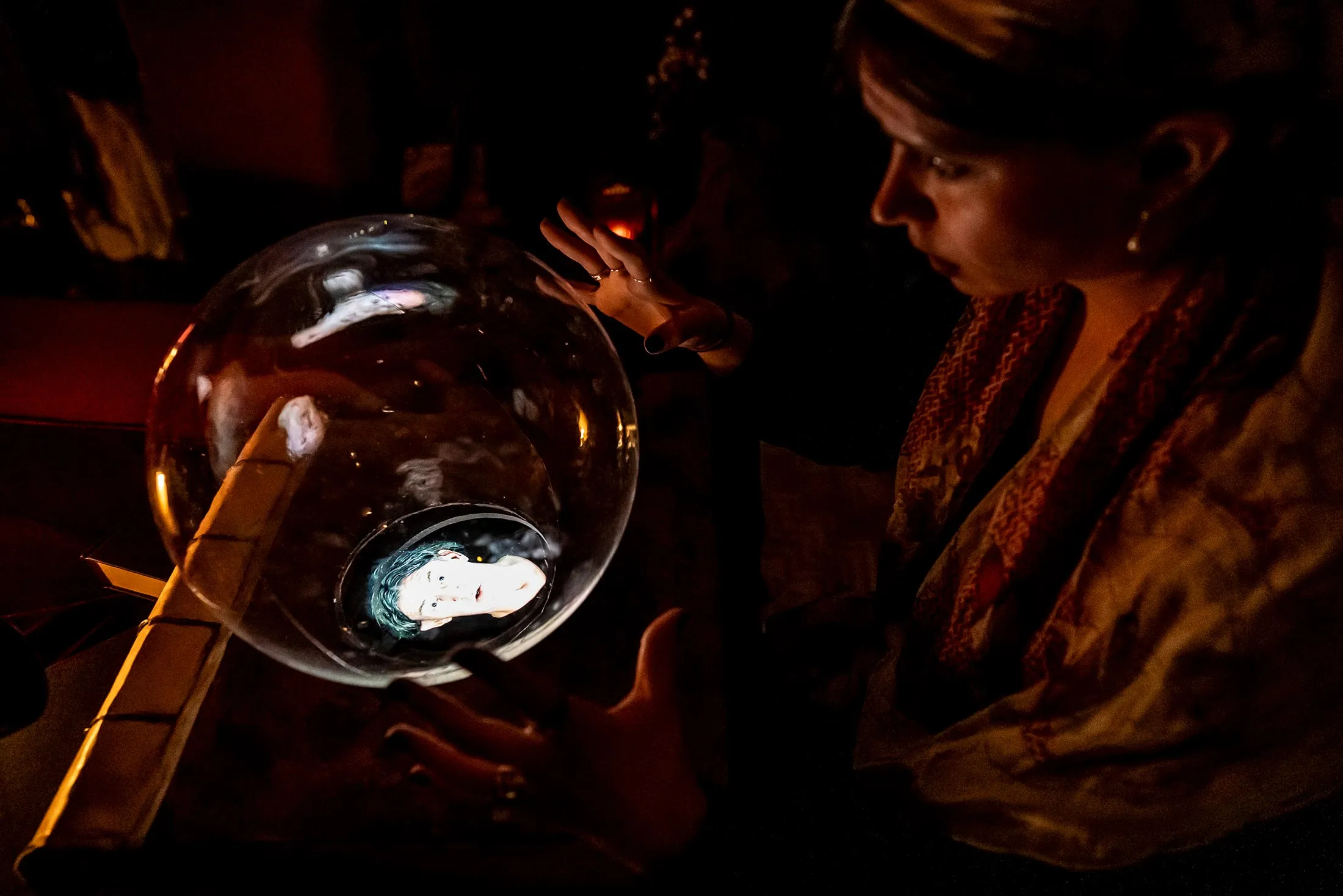 A medium conjuring the spirit of Houdini during a seance at the Chelsea Cell Theatre.