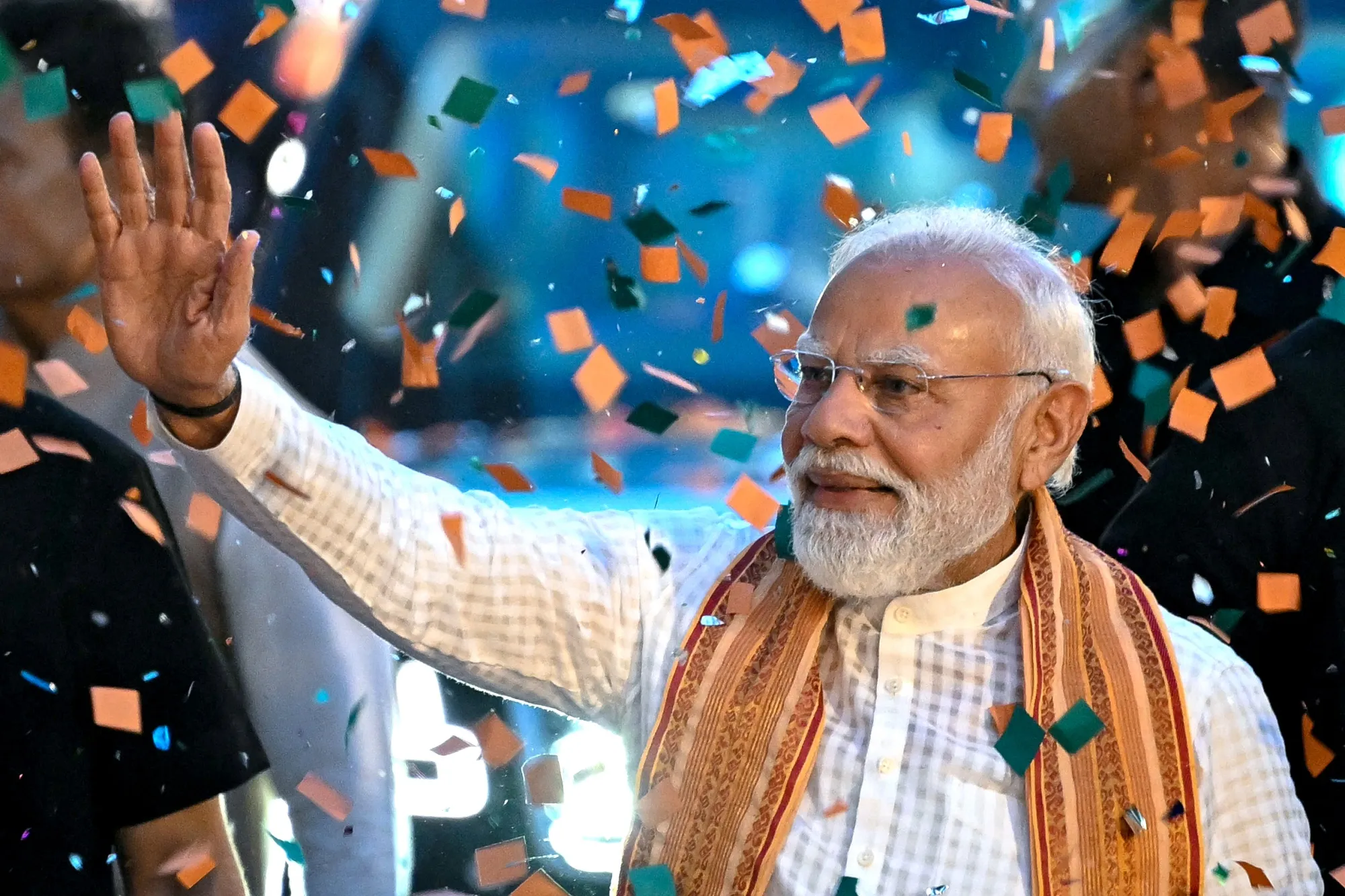 Narendra Modi waves to supporters at party headquarters in New Delhi on May 4.