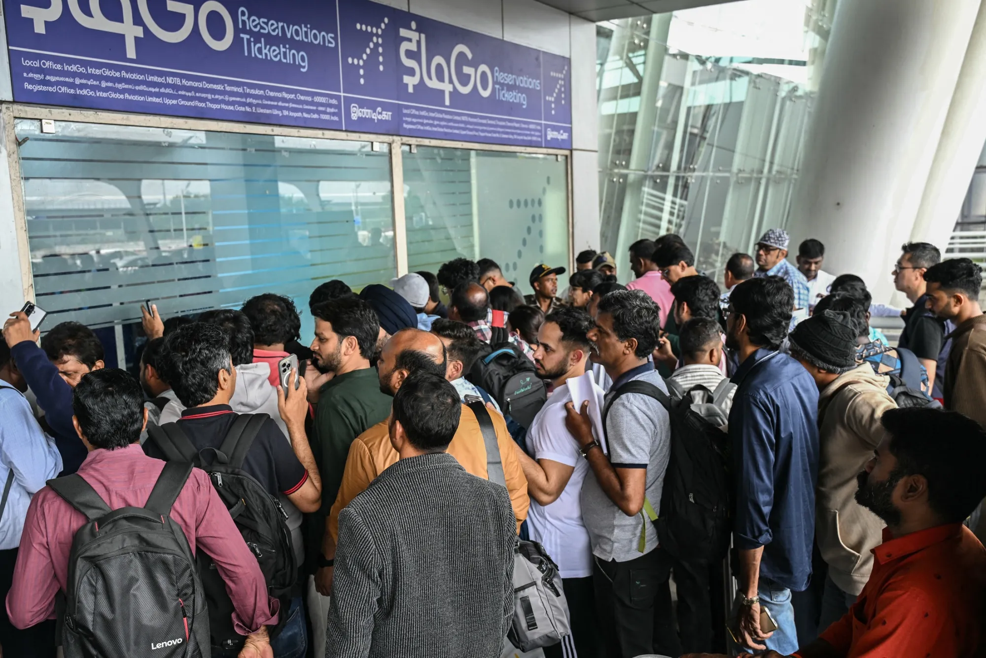 Travelers line up at an IndiGo Airlines kiosk at Chennai International Airport, on Dec. 5.