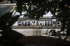 A Credit Suisse logo above the entrance to a Credit Suisse Group AG bank branch in Murten, Switzerland.