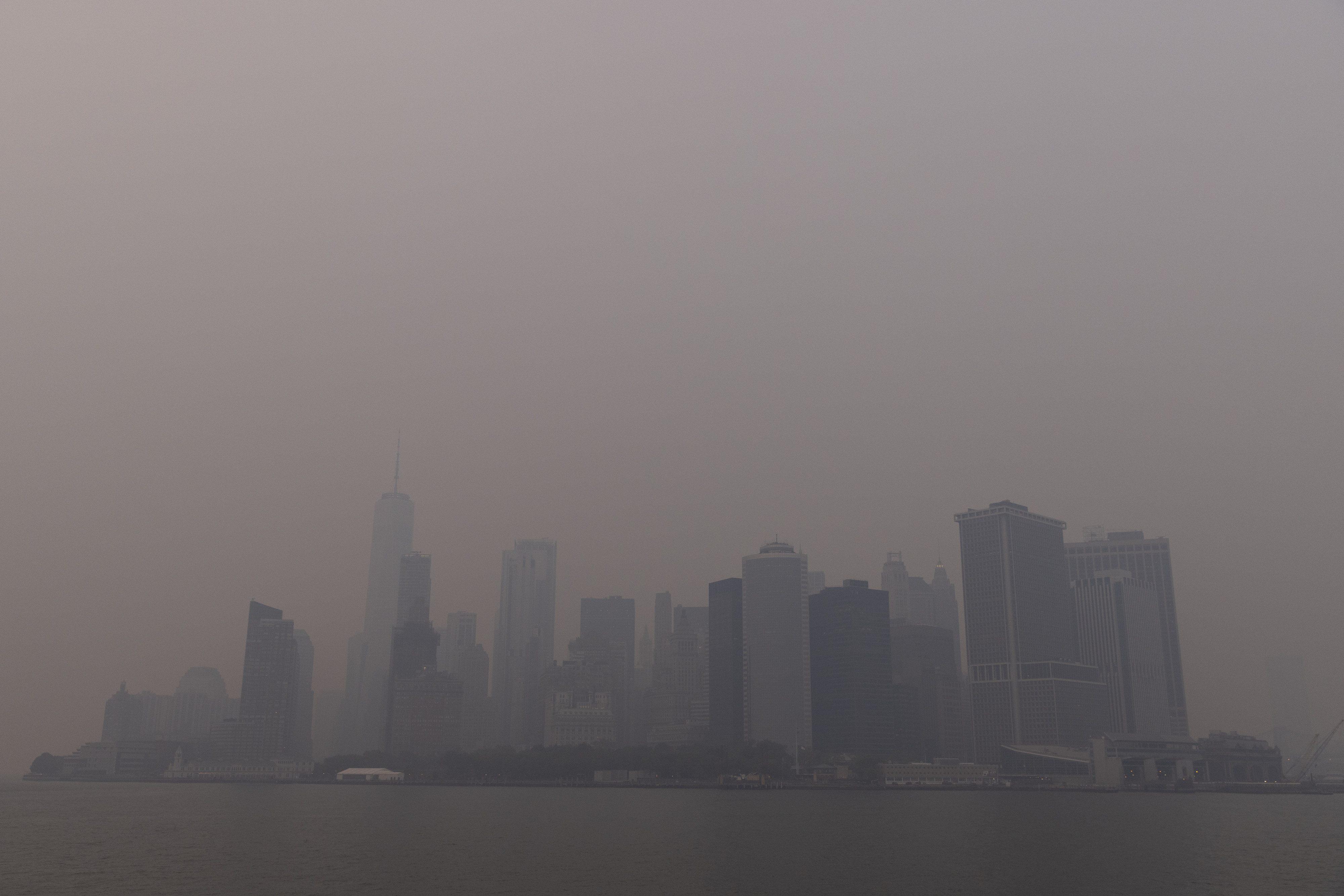 Buildings in Lower Manhattan shrouded in smoke from Canada wildfires in New York on June 7, 2023.&nbsp;