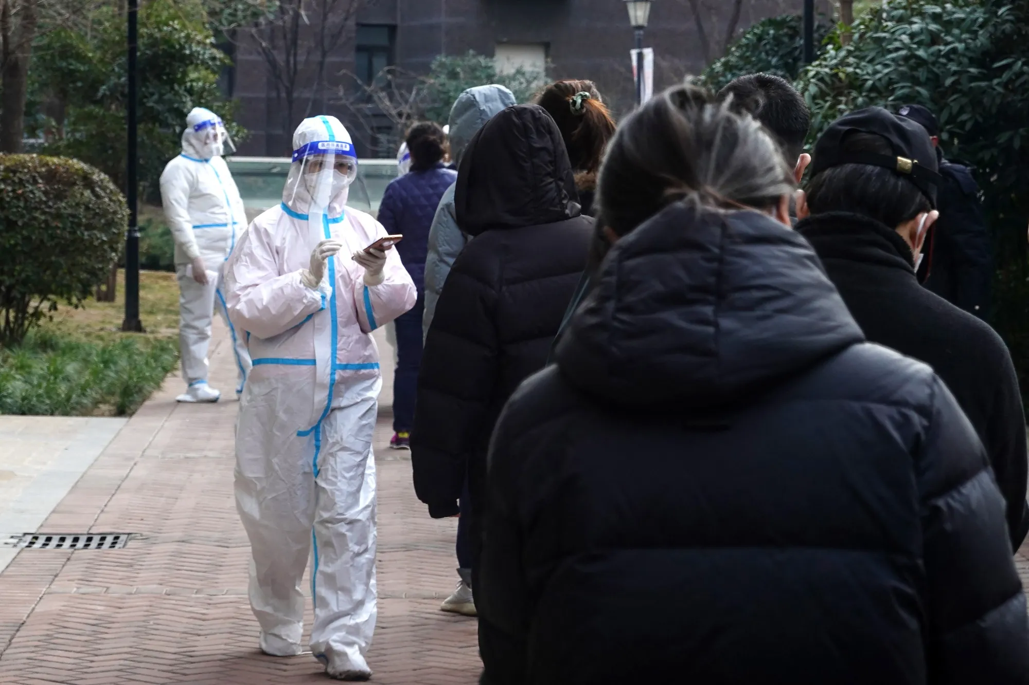 Residents in Xian queue to undergo Covid-19 testing&nbsp;on Jan. 14.