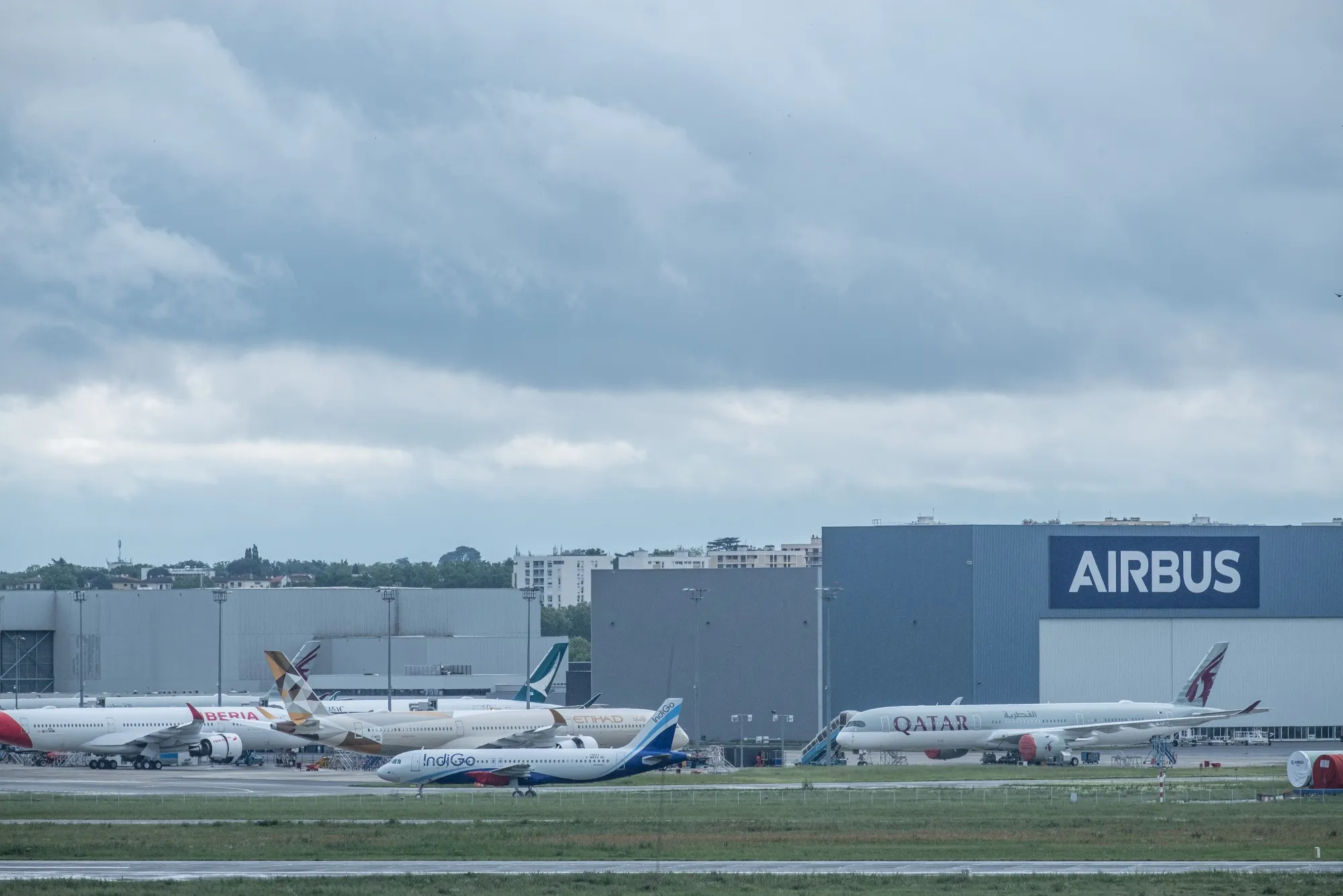 Passenger aircraft, manufactured by Airbus SE, stand outside the Airbus aircraft assembly factory in Toulouse, France.