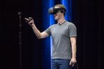 Mark Zuckerberg demonstrates an Oculus Rift virtual-reality headset and Oculus Touch controllers.
