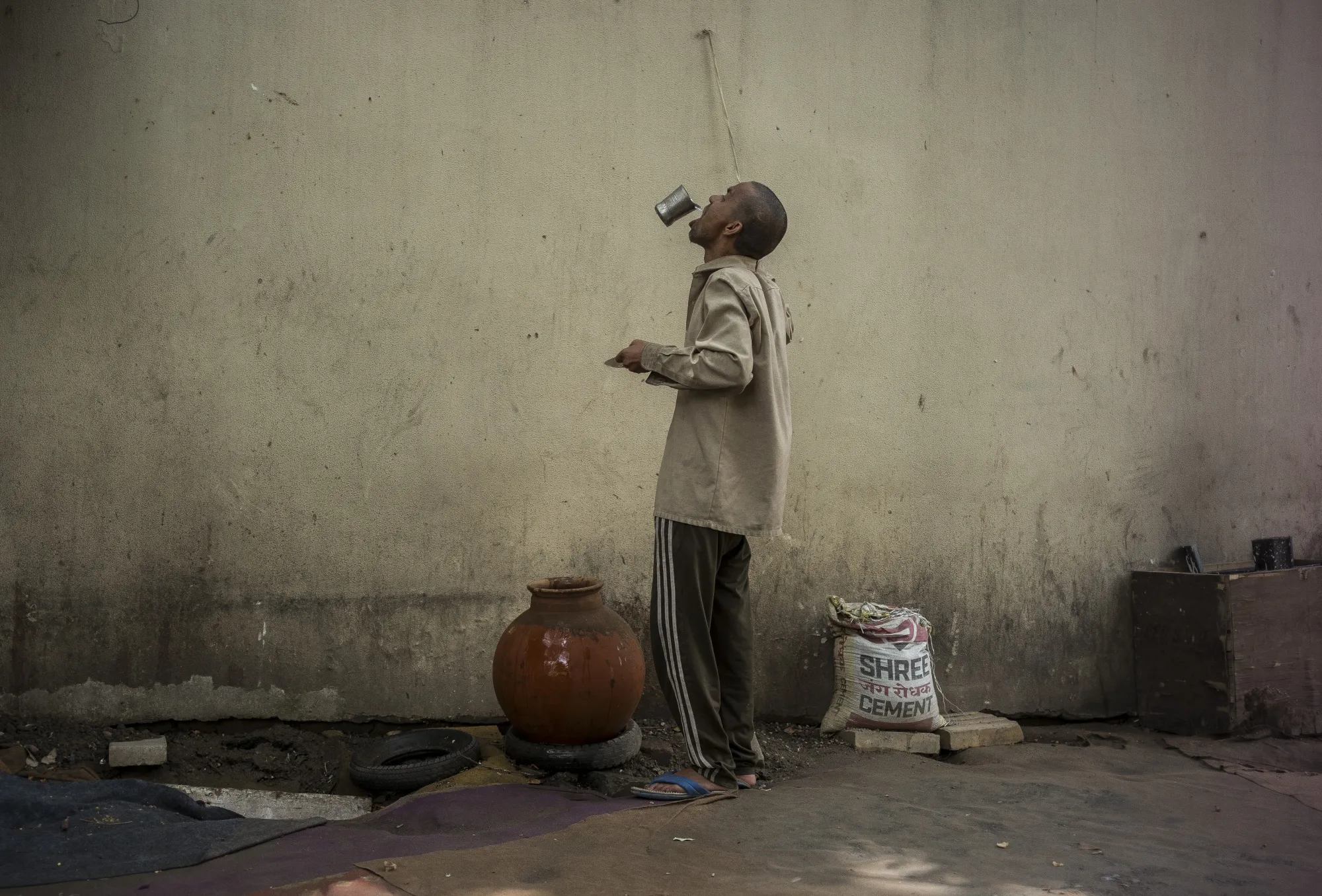 A man drinks water from a public water dispenser, locally called ‘Piyaoo’&nbsp;in New Delhi, India on May 1, 2022.