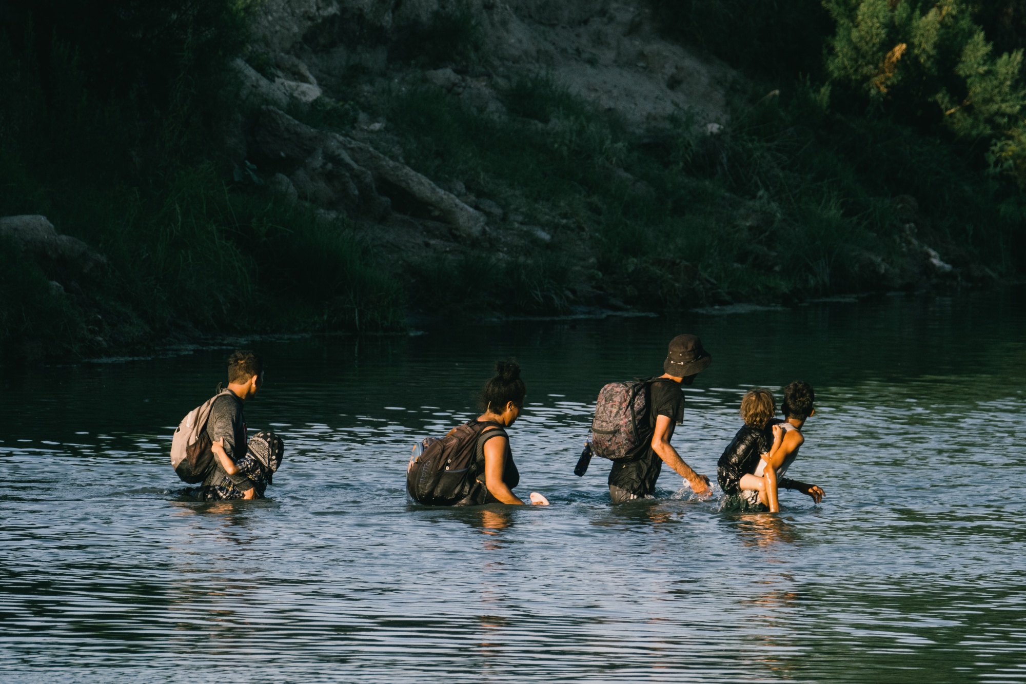 Migrants cross the Rio Grande River to&nbsp;Eagle Pass, Texas.