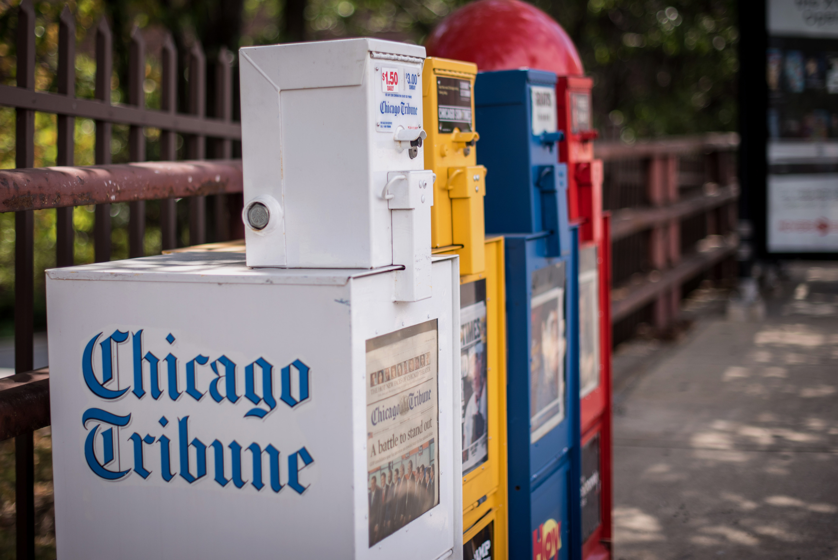 A Chicago Tribune newspaper vending machine or &quot;honor box&quot; sits on a sidewalk in Chicago, Illinois.