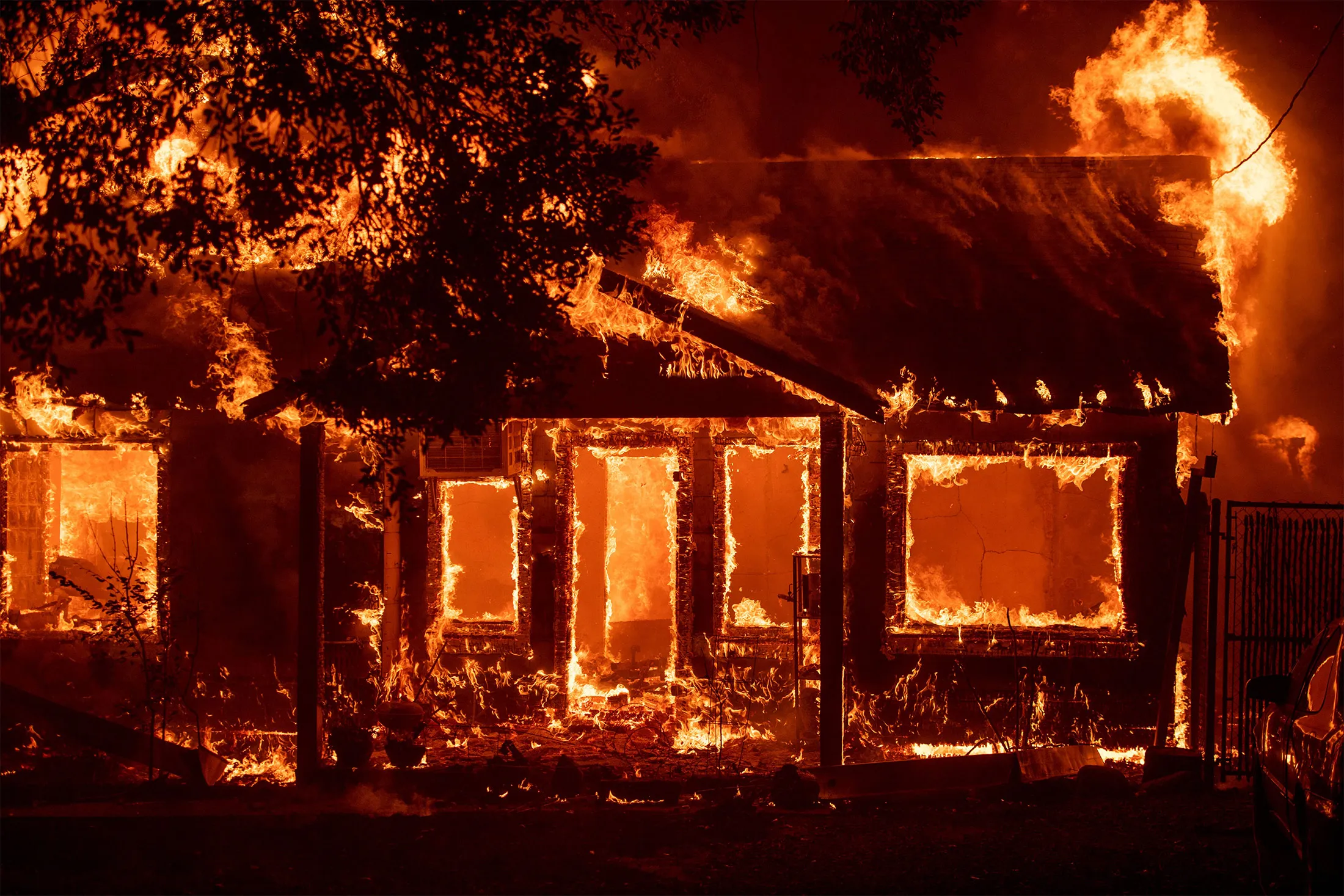 A home burns as the Camp fire tears through Paradise, California on November 8, 2018.