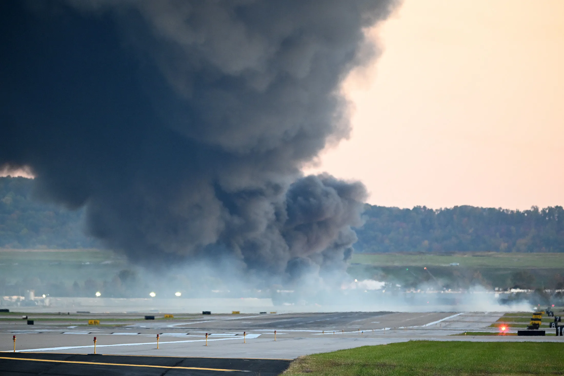 Fire and smoke following the crash of a UPS cargo plane near Louisville Muhammad Ali International Airport in Louisville, Kentucky, on Nov. 4, 2025.