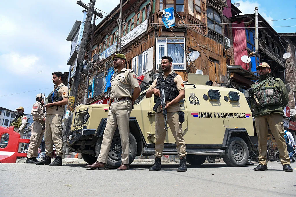 Police&nbsp;stand guard in a market in Srinagar, on May 10.