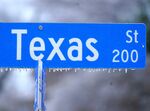 Ice forms on a Texas street sign in Richardson, Texas, on Feb. 3.&nbsp;