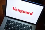 The Vanguard Group logo on a laptop computer arranged in New York, US, on Wednesday, Nov. 8, 2023. Vanguard Group Inc. is planning its first active exchange-traded funds in two years, with both new planned products focused on the fixed-income market. Photographer: Gabby Jones/Bloomberg