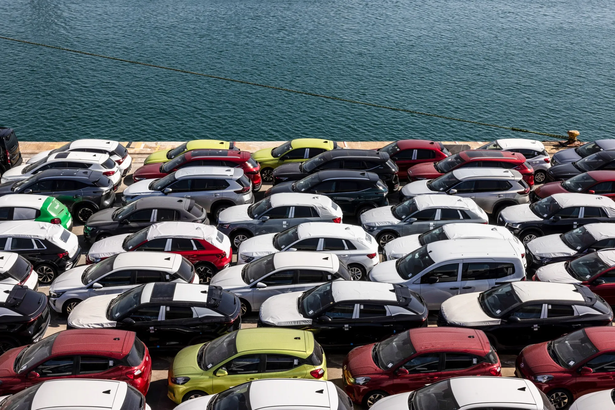 Newly manufactured automobiles on the dockside at the Port of Barcelona in Spain.