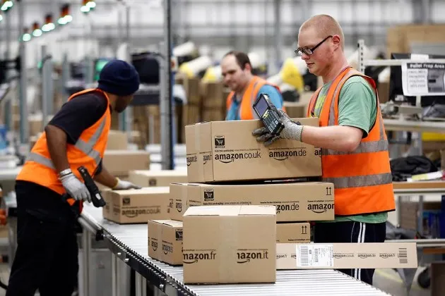 Employees at one of Amazon.com's fulfillment centers on Dec. 2, 2013