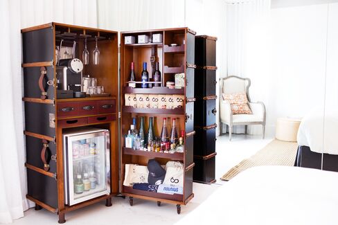 Stocked with assorted gummy bears, cashews, smoked almonds, and jelly beans, as well as a Nespresso machine.