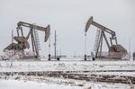 Pumpjacks operate in the snow in the Permian Basin in Midland, Texas.