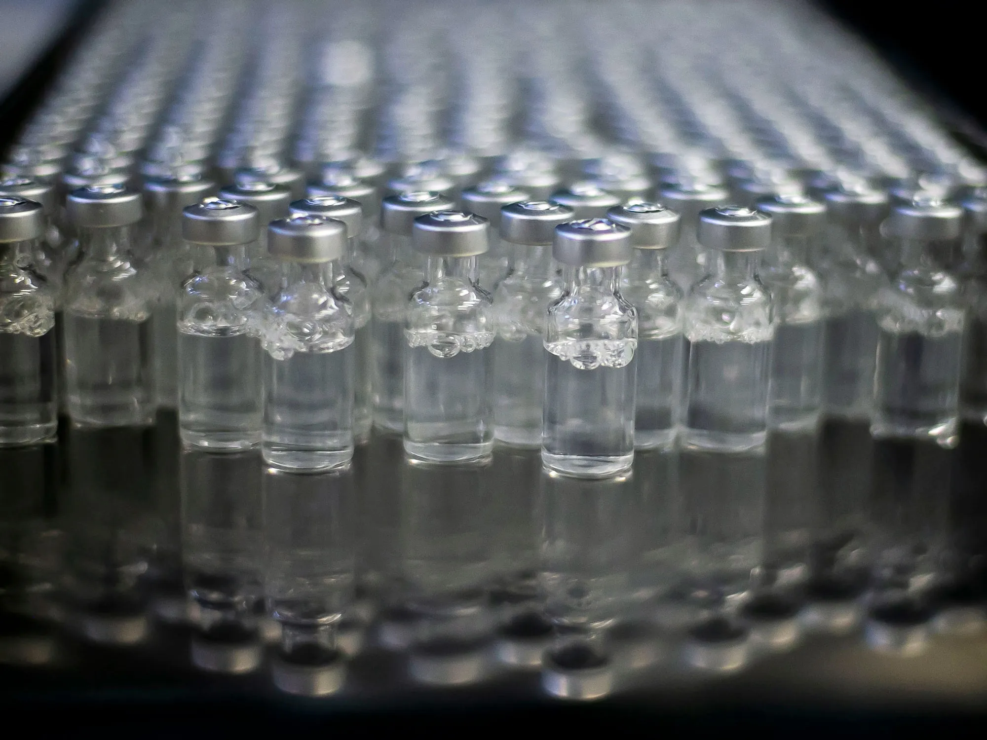 Doses of AstraZeneca vaccines for COVID-19 sit in vials at the Fiocruz Foundation after being bottled in Rio de Janeiro, in February 2021.