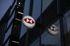 A sign featuring a HSBC Holdings Plc logo hangs outside a bank branch in London, U.K., on Wednesday, Nov. 6, 2019. The U.K. is headed to the polls on Dec. 12, bringing banks, utilities and housebuilders into focus for U.K. equity investors.