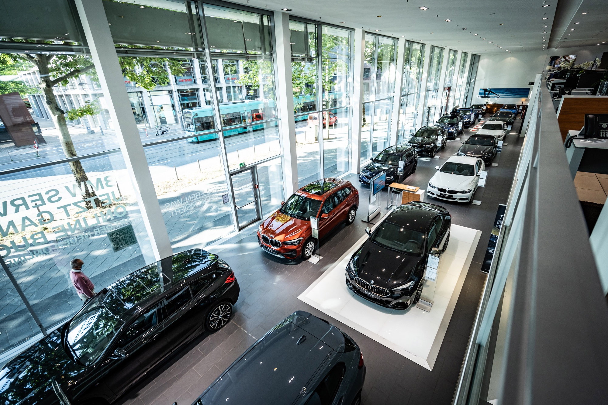 A range of new automobiles stand on display inside a Bayerische Motoren Werke AG showroom in Frankfurt, on Aug. 4.