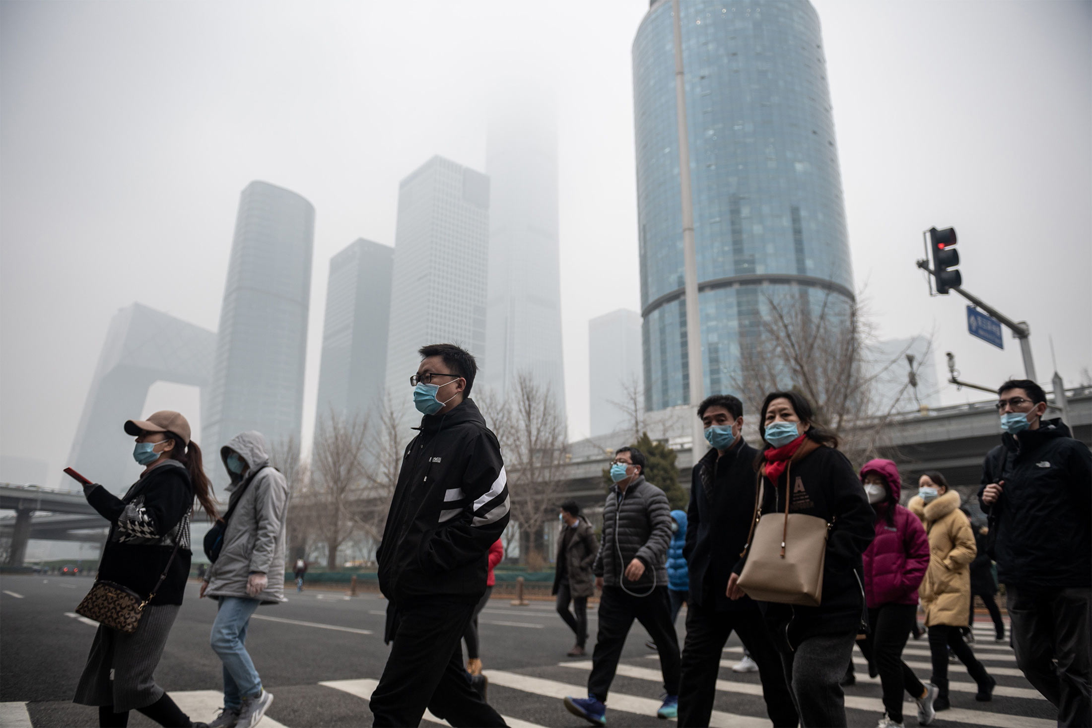 People commute during the morning rush hour on a polluted day in Beijing on March 4.