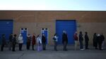 People wait in line to vote at the Caroline High School polling station, on November 6, 2012 in Milford, Virginia.
