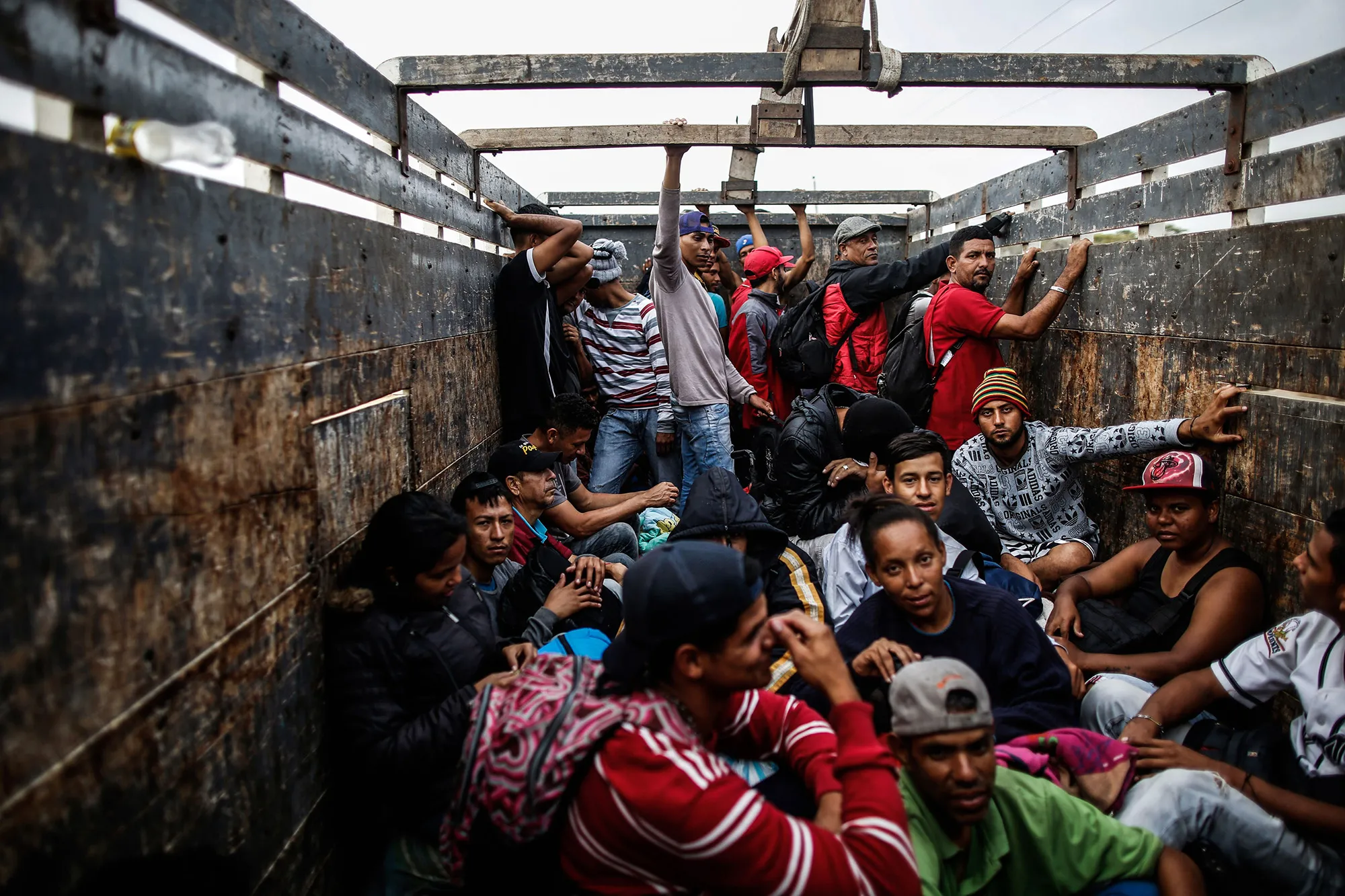 Venezuelan migrants travel aboard a truck after leaving a border care center&nbsp;in Tumbes, Peru, near the border with Ecuador, on Nov.&nbsp;1, 2018.&nbsp;