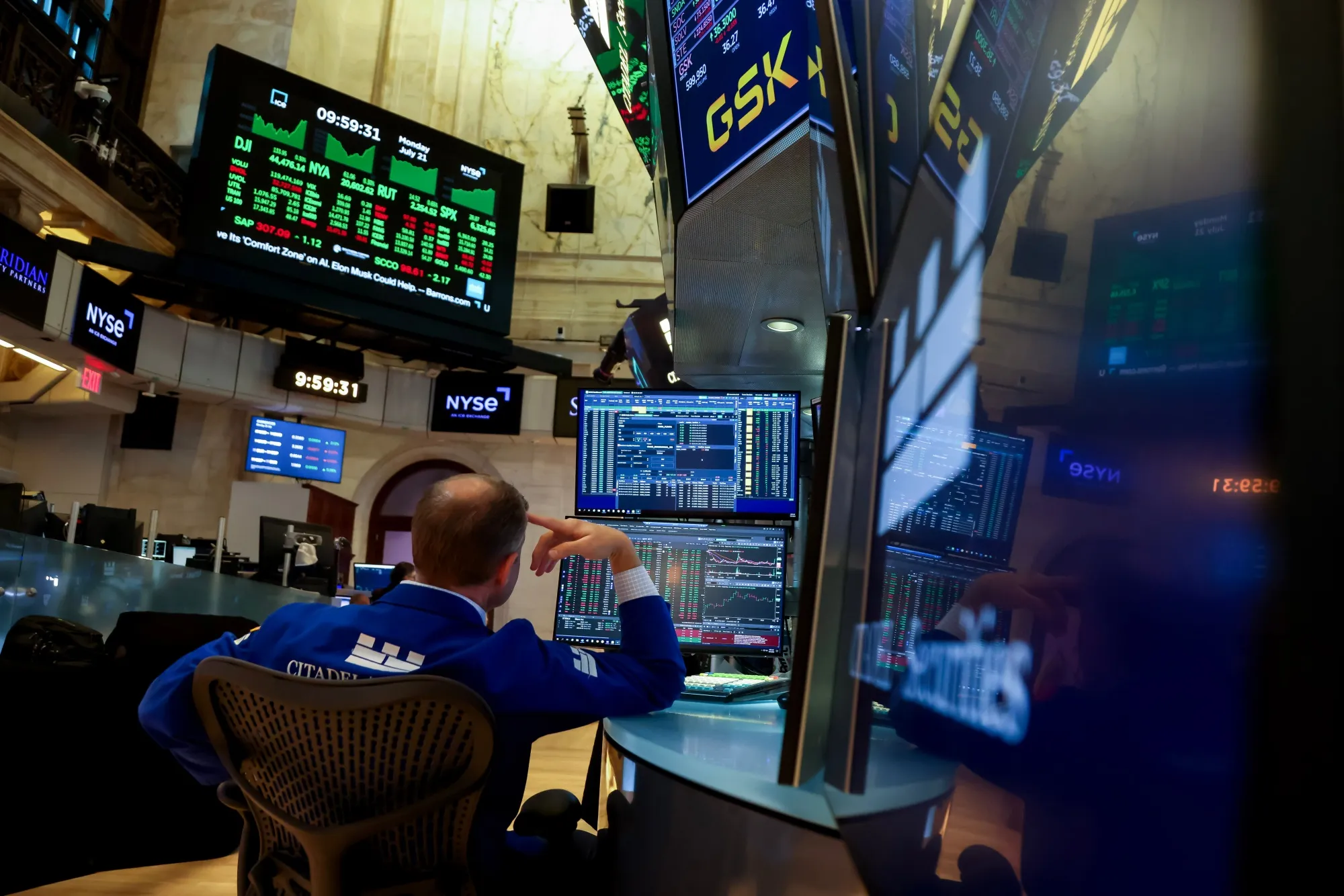 A trader works on the floor of the New York Stock Exchange.