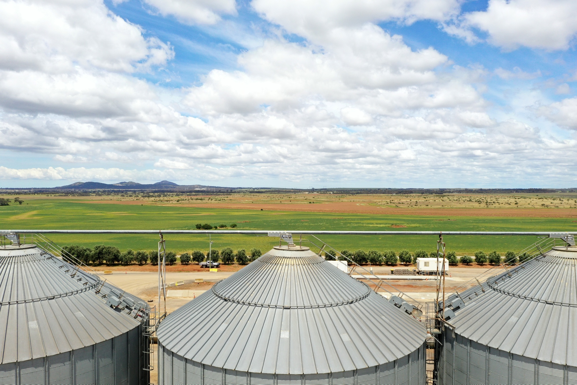 Grain silos at a Riordan Grains storage facility in Balliang, Victoria, Australia, on Tuesday, Nov, 9, 2021. For the second season in a row, the stars are favorably aligned for Australian wheat growers -- a bumper harvest, a shortage of one of the world's most important foods and global prices near nine-year highs. Photographer: Carla Gottgens/Bloomberg