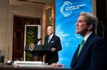 President Joe Biden speaks while John Kerry, U.S special presidential envoy for climate, right, listens during the virtual Leaders Summit at&nbsp;the White House on&nbsp;April 23.&nbsp;