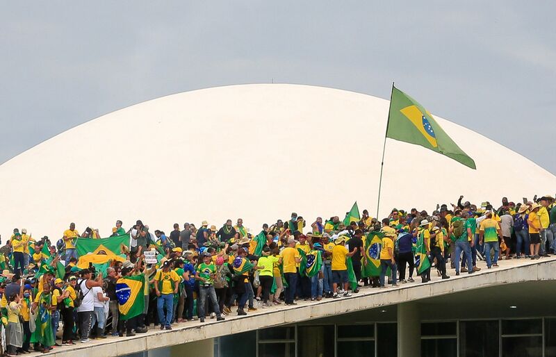 Supporters of Jair Bolsonaro ascend one of architect Oscar Niemeyer’s many ramps as they attack the National Congress in Brasília on Jan. 8, 2023.