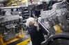 A worker assembles components on a diesel engine at a factory in Seymour, Indiana.